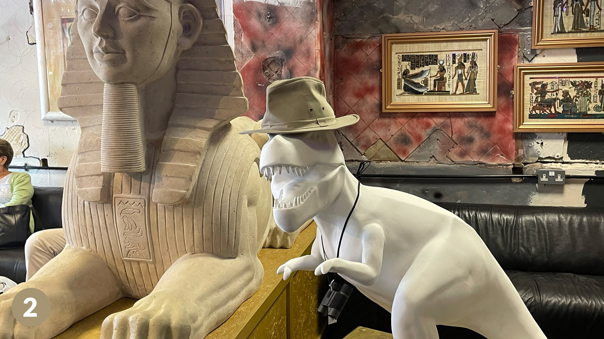 Dinosaur staue in hat