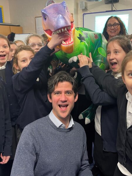 Mathew Conway photographed with students of Diss school